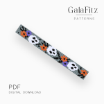 Halloween loom bracelet with white skulls and orange and purple flowers on a gray background.